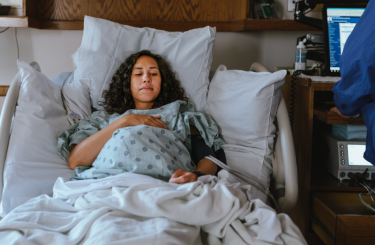 Woman resting in hospital bed