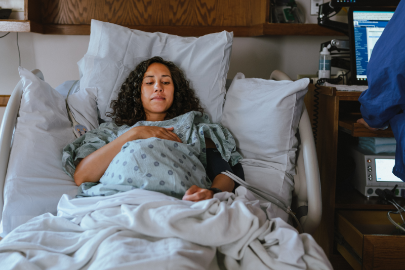 Woman resting in hospital bed