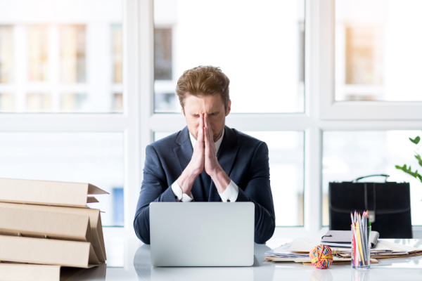 Frustrated Young Employee Is Working Wearily