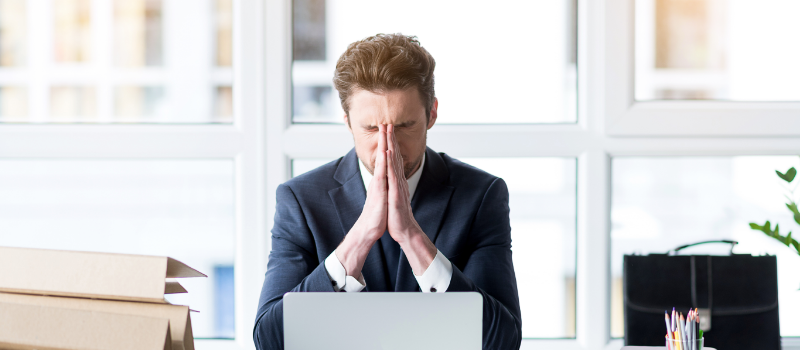 Frustrated Young Employee Is Working Wearily