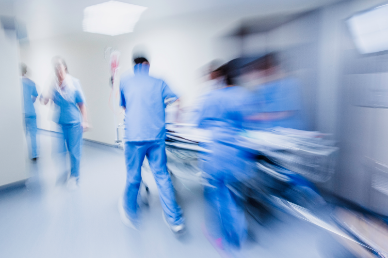 Emergency room attendants moving quickly