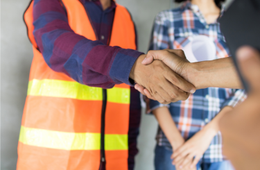 Workers shaking hands