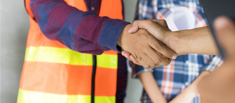 Workers shaking hands
