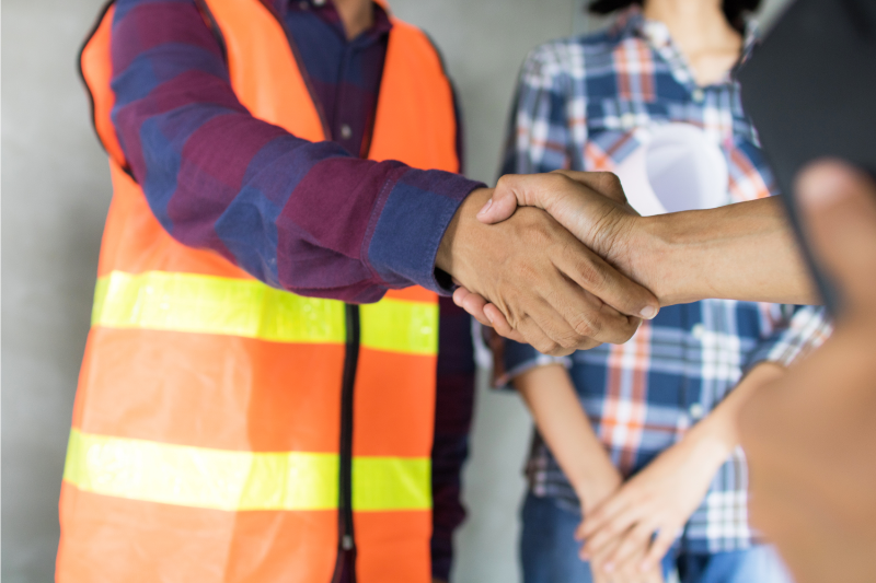Workers shaking hands