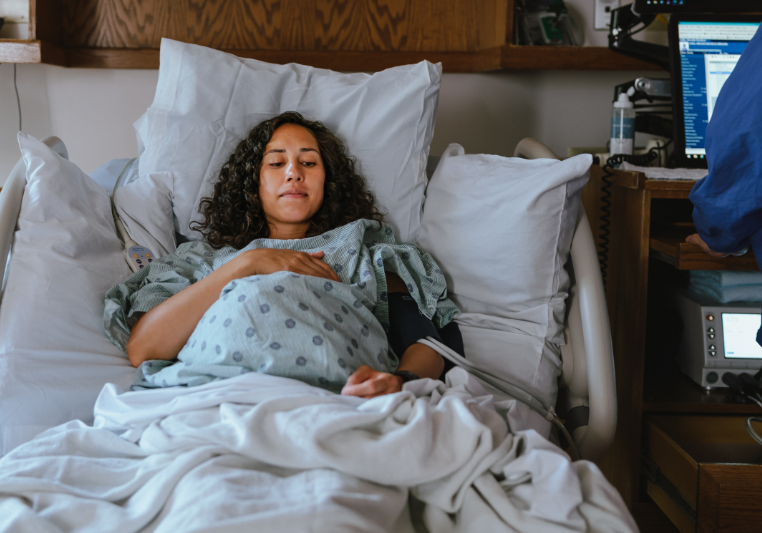 Woman resting in hospital bed