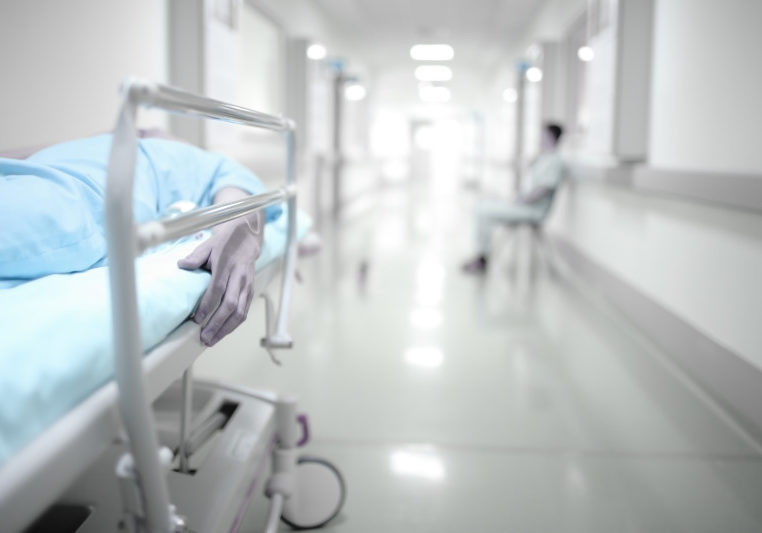 Person waiting in ER hallway