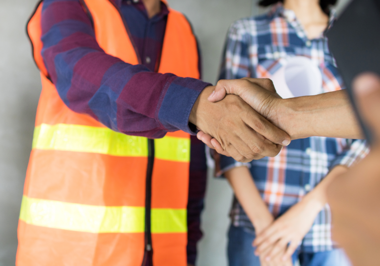 Workers shaking hands